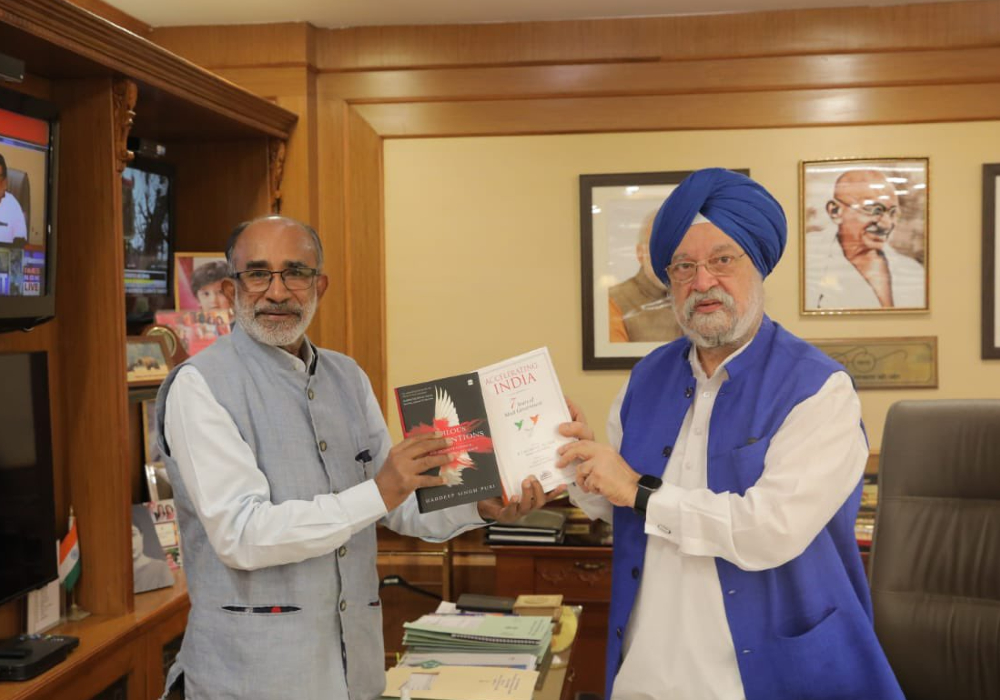 Met with Parliamentarian Sh Alphons Kannanthanam Ji . He very kindly presented a copy of his book ‘Accelerating India - 7 Years of Modi Government’ to me
